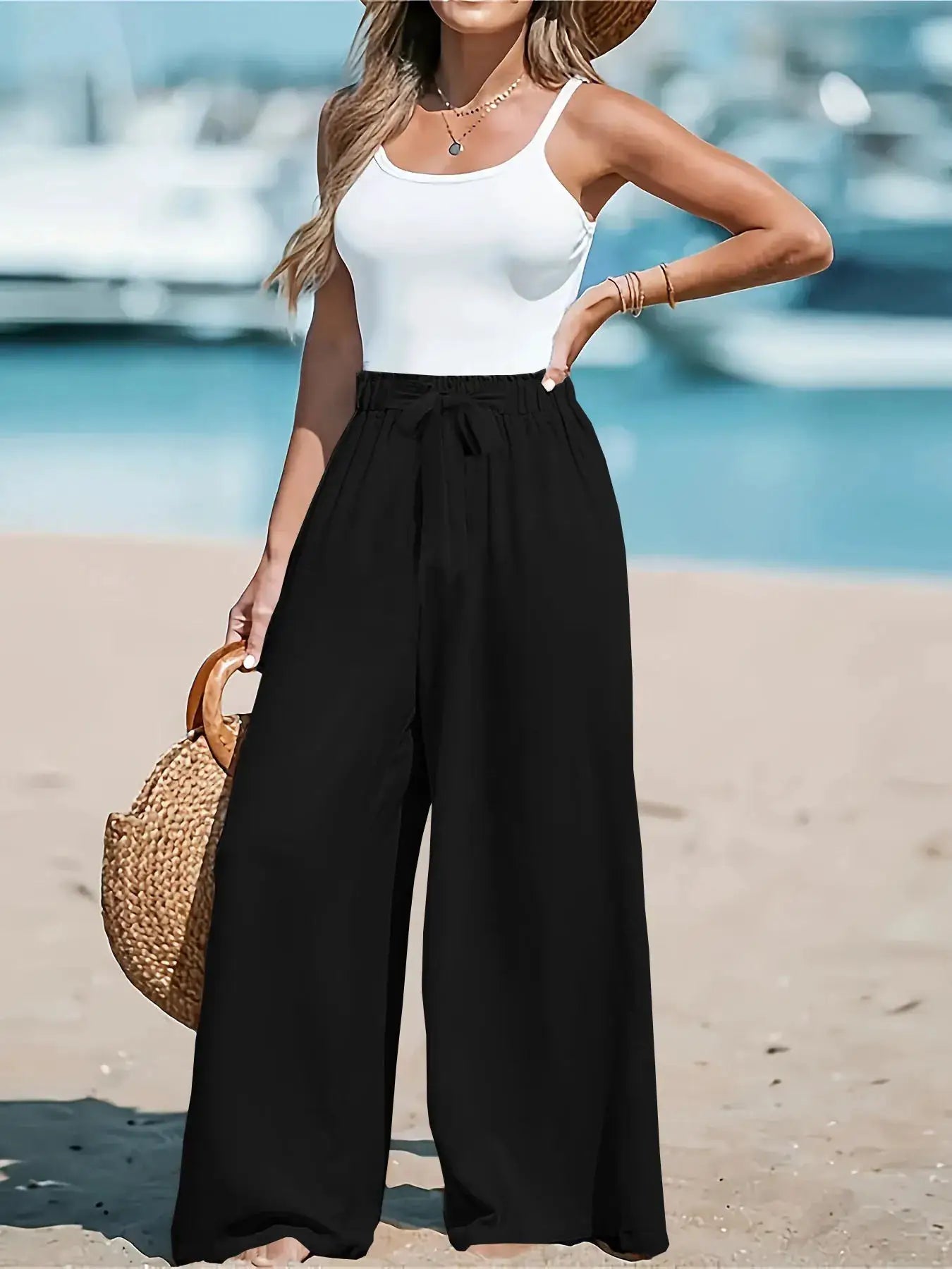 Full Size Drawstring Waist Wide Leg Pants by Belle Bijouix, black wide-leg trousers with tie waist.