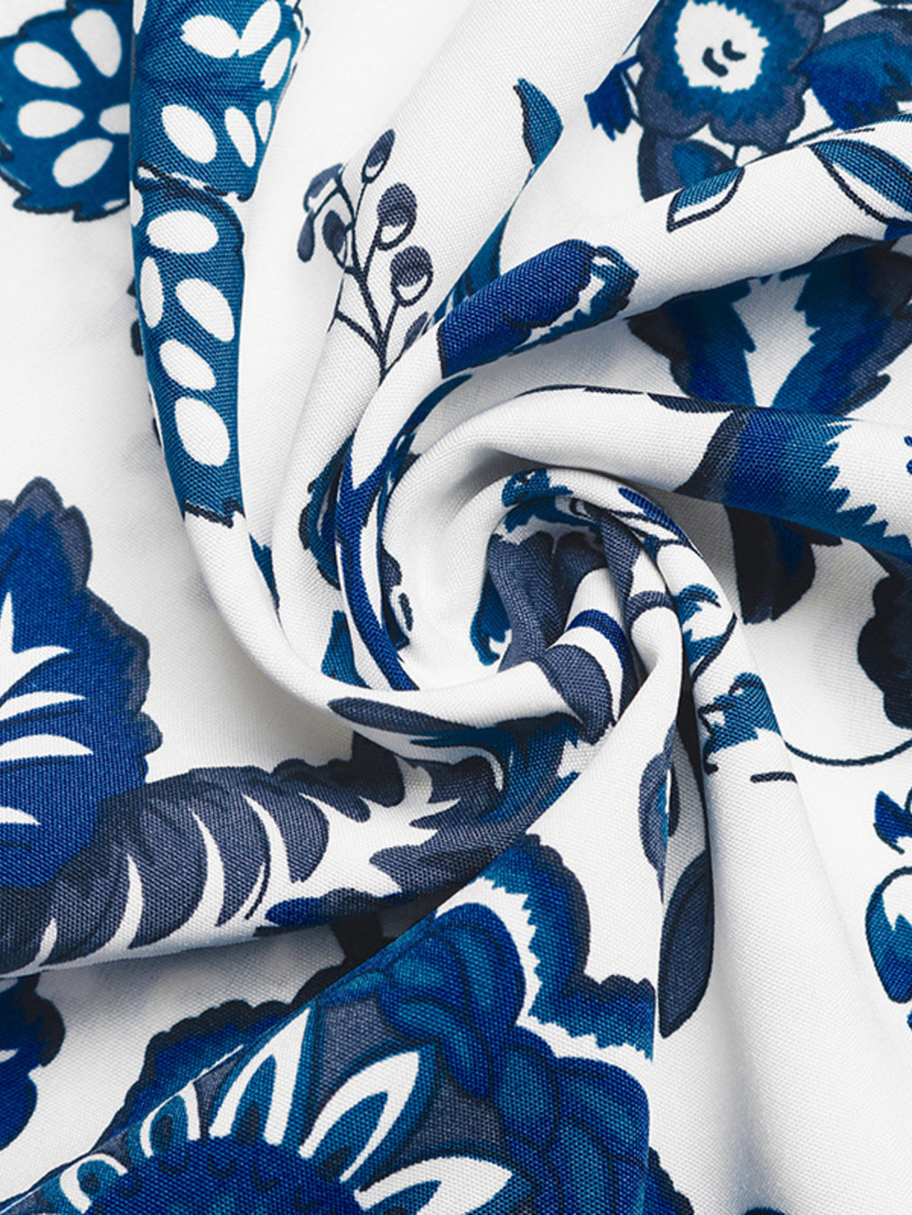 Floral print dress fabric in blue on white, close-up botanical pattern texture