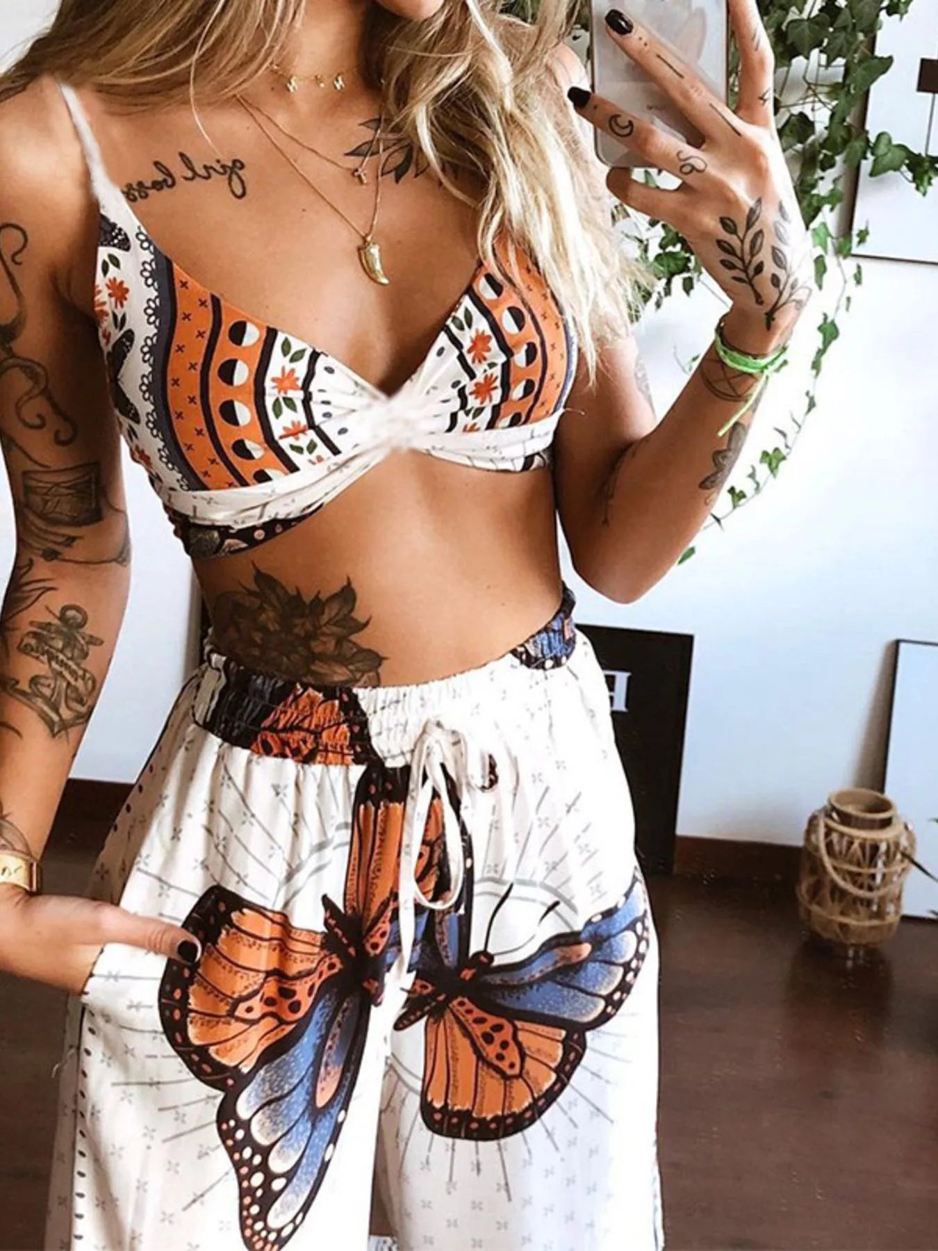Boho butterfly-print top and pants set, two-piece in orange and white by Trendsi