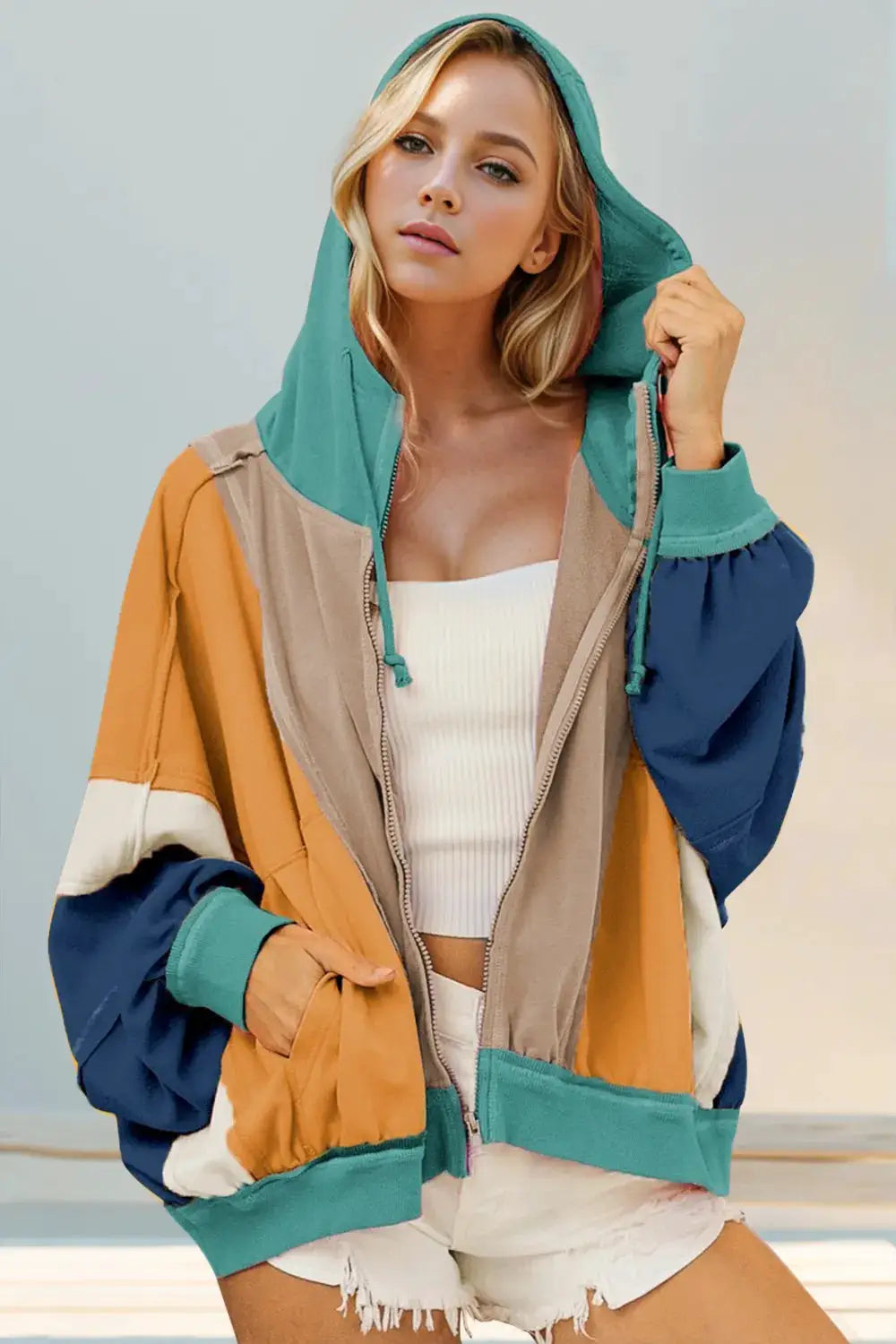 Double Take full-size color-block zip-up hoodie by Belle Bijouix; teal hood, orange/beige/blue blocks, pocketed top.