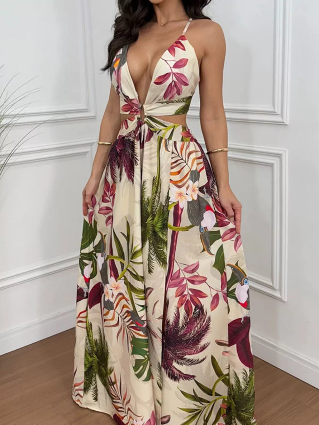 Tropical Print Plunge Cutout Maxi Dress by Trendsi, beige base with pink florals and green foliage.