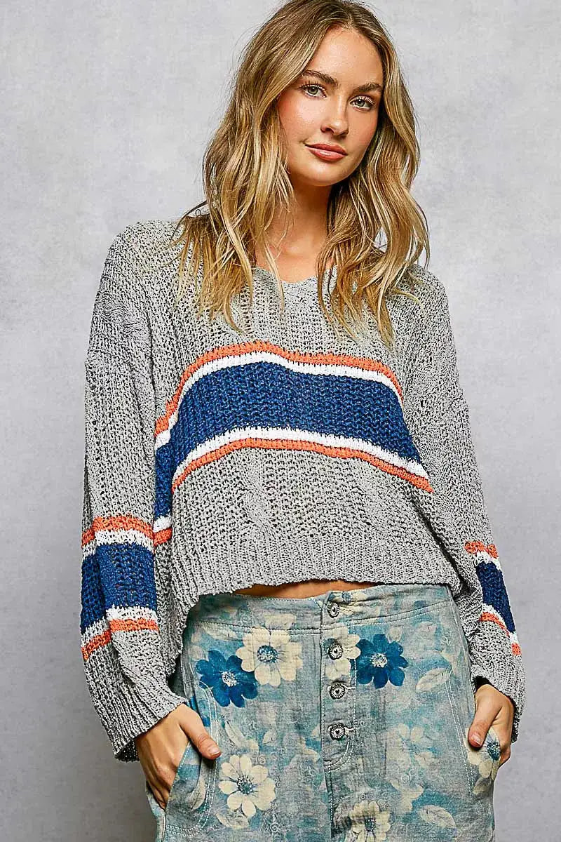 Knit top with V-neck cropped fit in gray, featuring blue and orange striped bands and cable knit detail