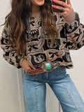 Bows & Horseshoes Pattern Round Neck Sweater, tan and black knit with pocketed detail