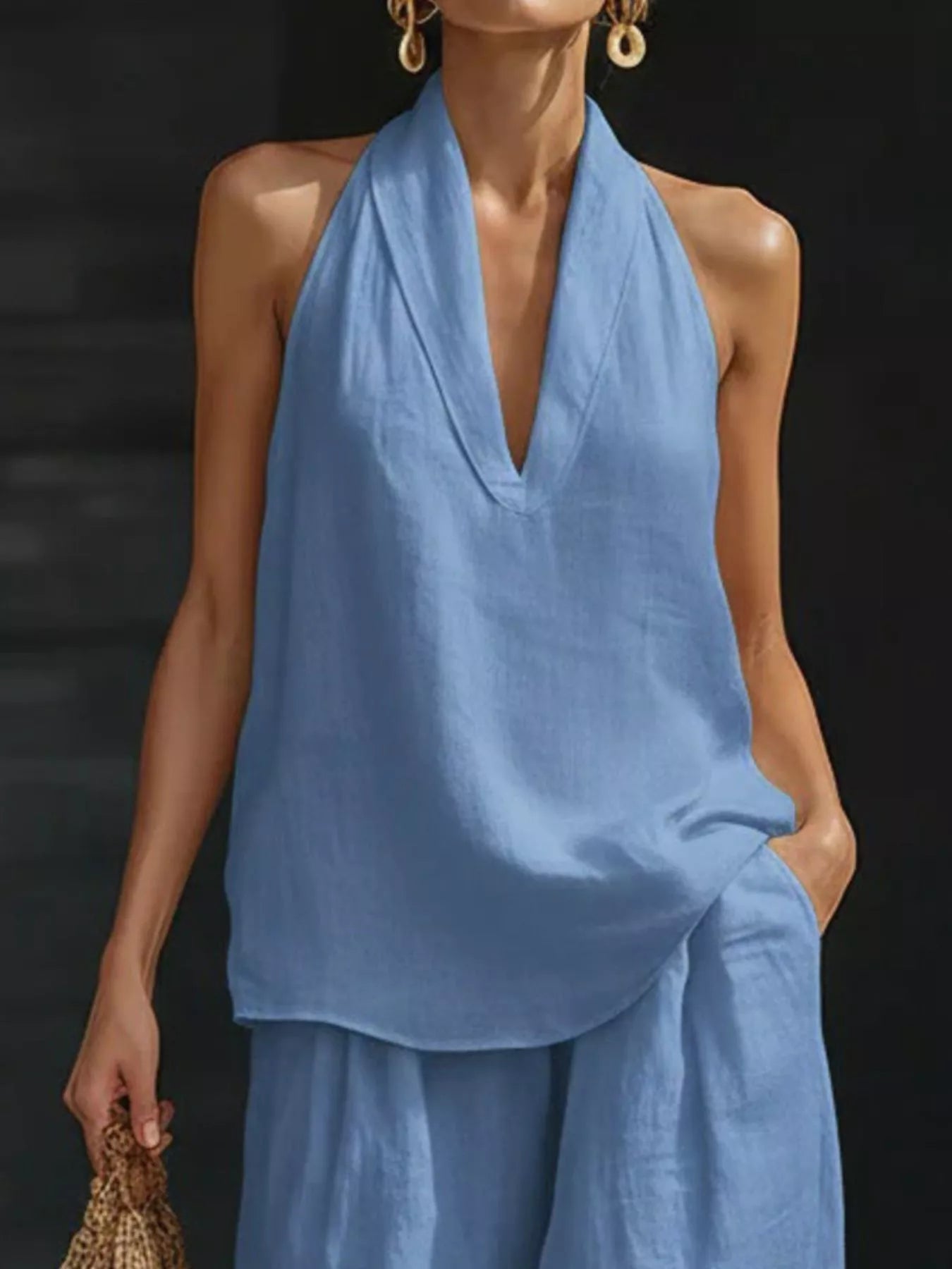 Plus-size halter-neck top and wide-leg pants set in light blue by Trendsi