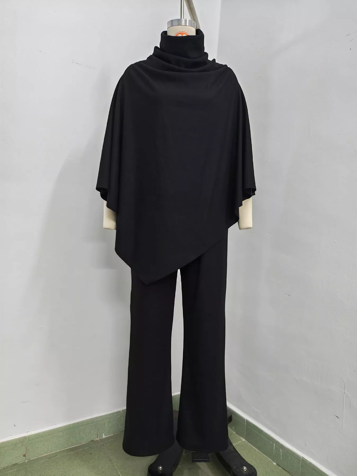 Turtleneck Poncho & Wide-Leg Pants Set in Black by Belle Bijouix – view 17 of 24
