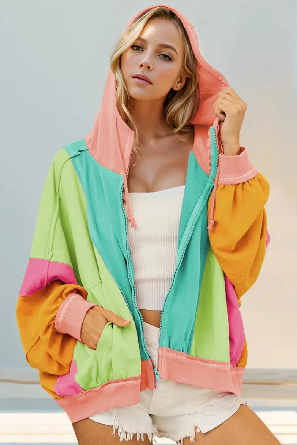 Double Take Full Size color-block zip-up hoodie with pastel panels, pink hood, pocketed, exposed zipper