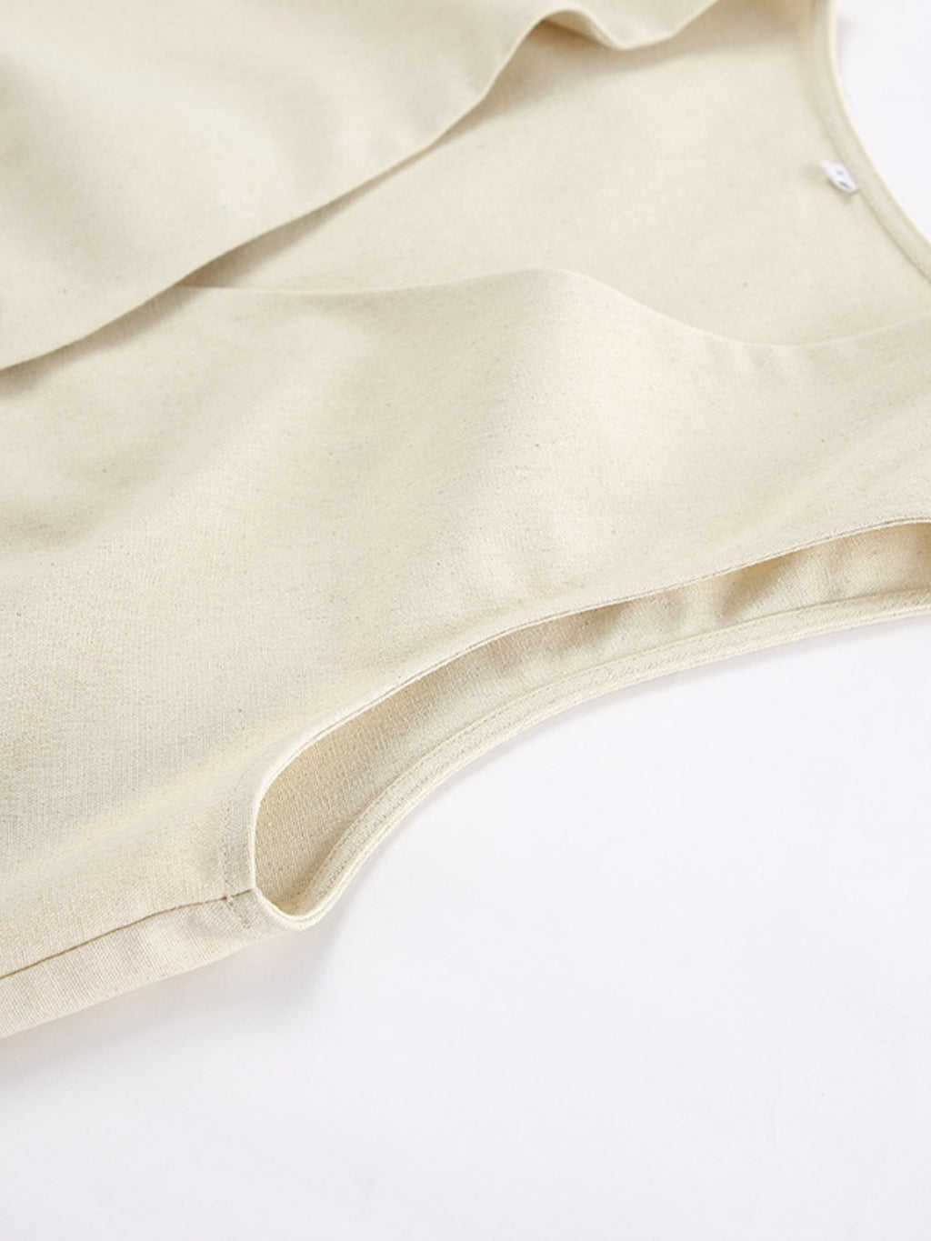 Button Up Vest and Shorts Set in cream fabric, close-up of soft, smooth material